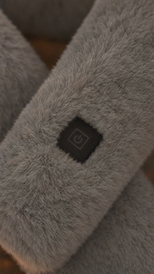 Close-up of the heat control light on the Cinderly USB heated scarf